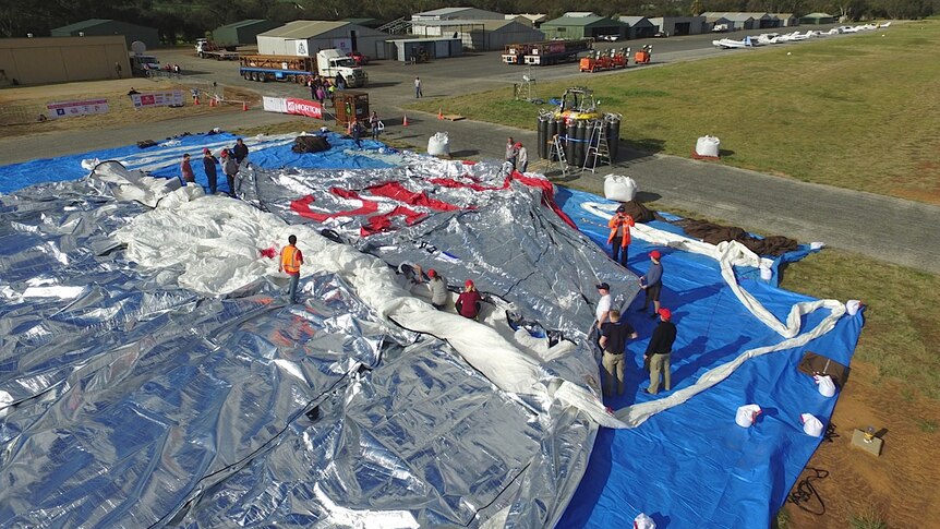 Crew members prepare Fedor Konyukhov's hot-air balloon.