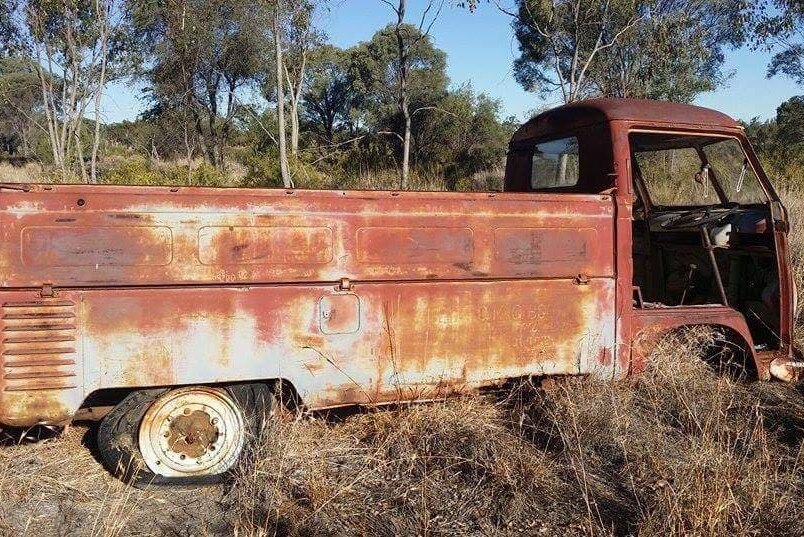 Rusted up old car in paddock