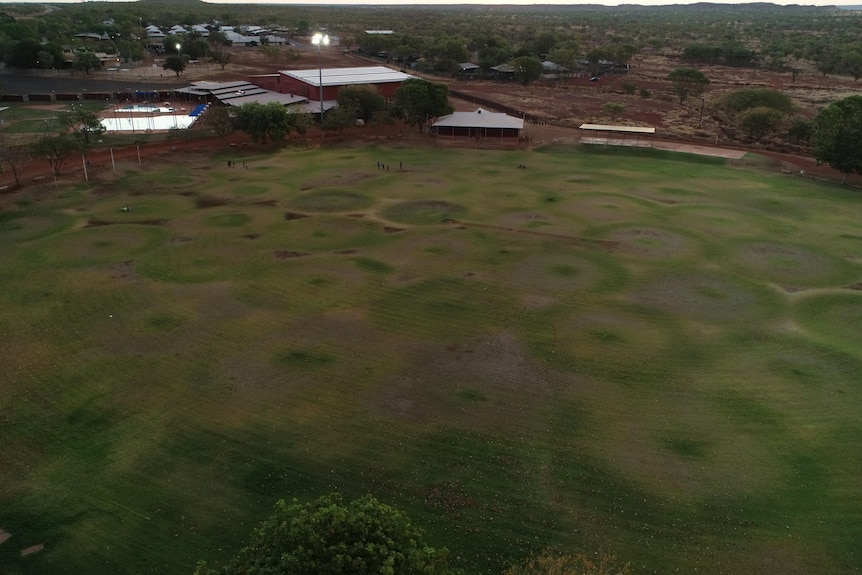 A football oval on the fringe of an outback town