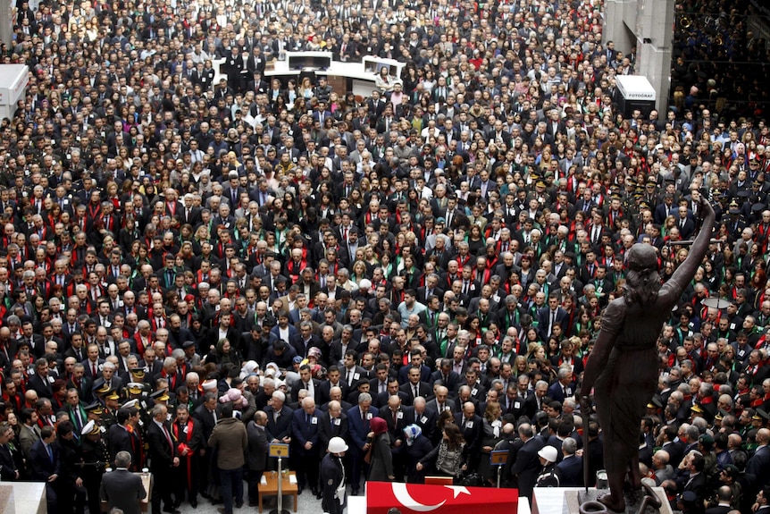 People attend the funeral ceremony of prosecutor Mehmet Selim Kiraz