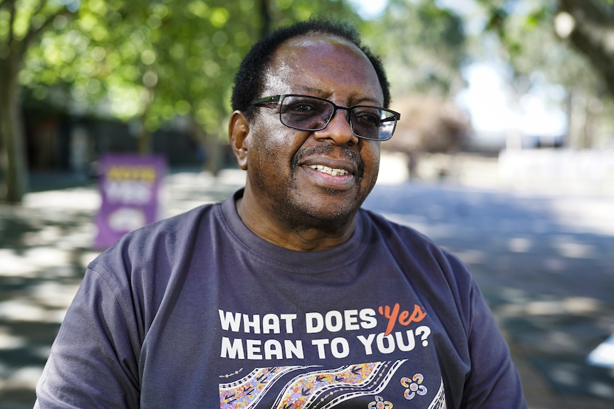 Profile of president of Zambia Australia Relief Association Tredwell Lukondeh wearing a 'What does Yes mean to you' shirt