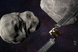 Rendered image of spacecraft heading towards an asteroid in space. 