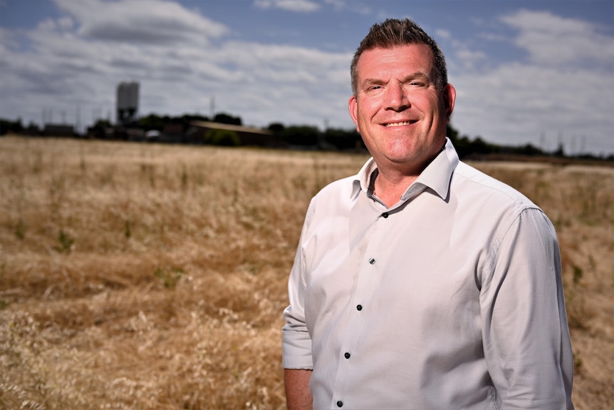 A man stands in a field