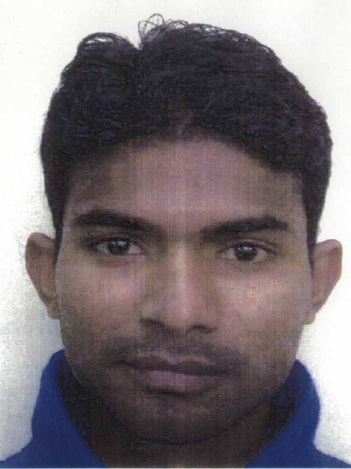 A portrait photo of a man of South Asian appearance.