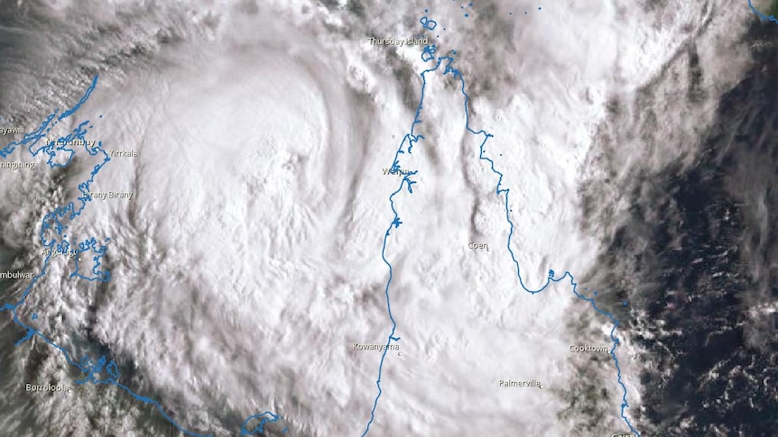 A satellite view of Tropical Cyclone Nora over the Gulf of Carpentaria, with the Queensland and NT coast shown in outline