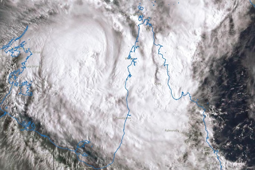 A satellite view of Tropical Cyclone Nora over the Gulf of Carpentaria, with the Queensland and NT coast shown in outline