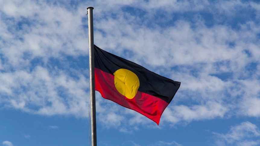 An Aboriginal flag flies in the breeze.