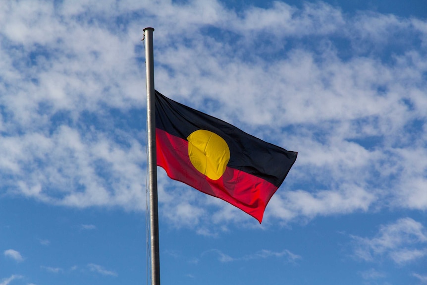 An Aboriginal flag flies in the breeze.