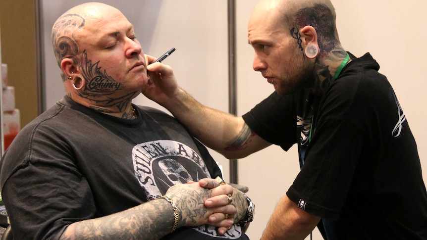 Tattoo artist at the Australian Tattoo and Body Art Expo in Perth, June 6, 2014.