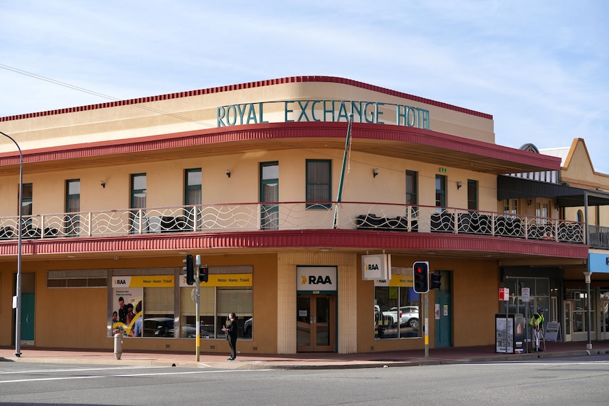A cream coloured two storey building Royal Exchange Hotel in Broken Hill with an RAA office underneath