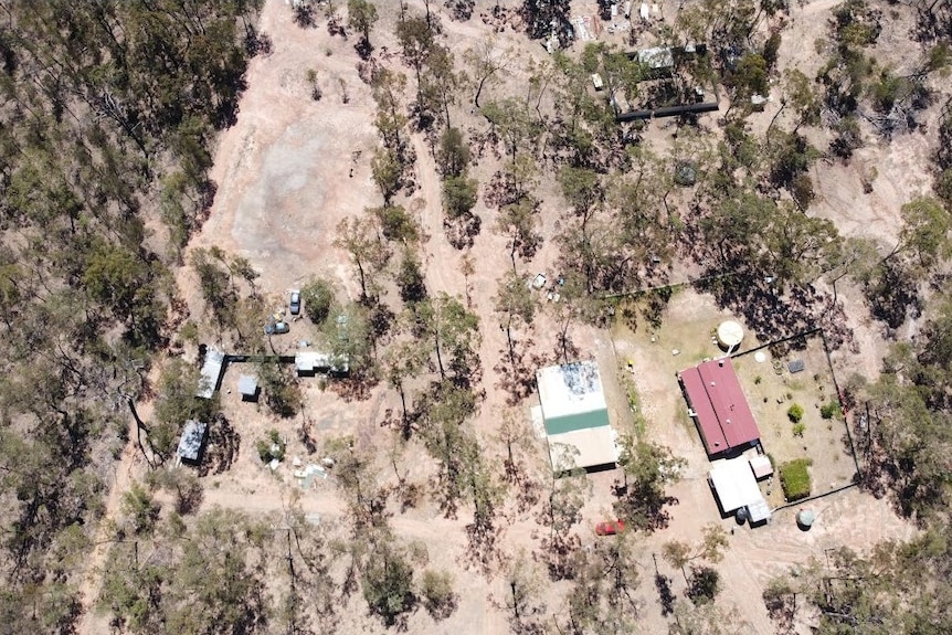 aerial photo of remote property with house and buildings 