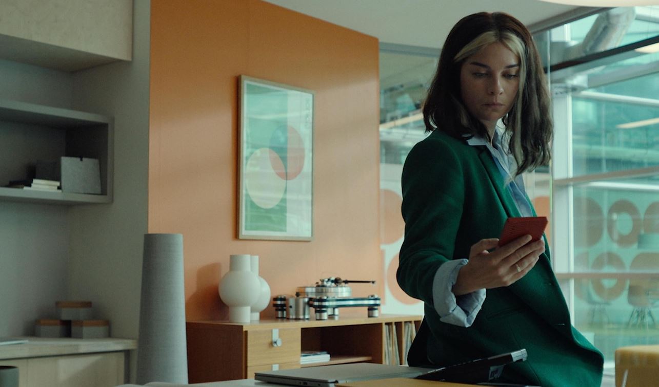 A woman looks at her phone 