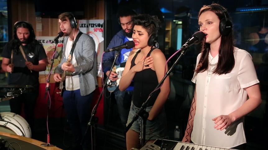 A photo of Ayla doing a live performance of 'Throw Your Arms Around Me' in the triple j studios