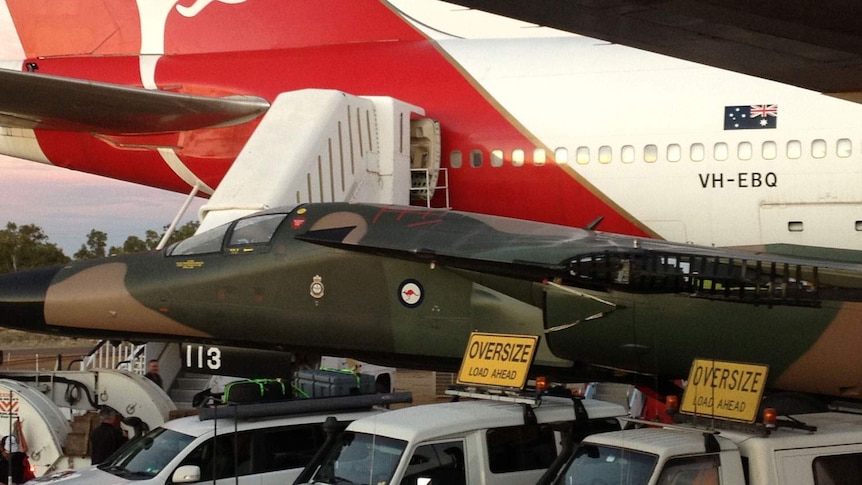 Retired F-111 jet makes stop at Qantas museum on Longreach in central-west Qld on June 13, 2013