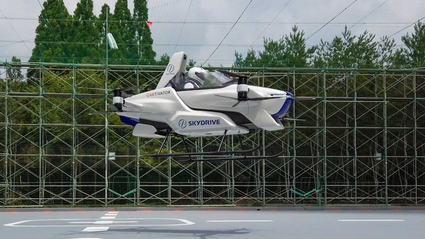 A flying car hovering about two metres above the ground