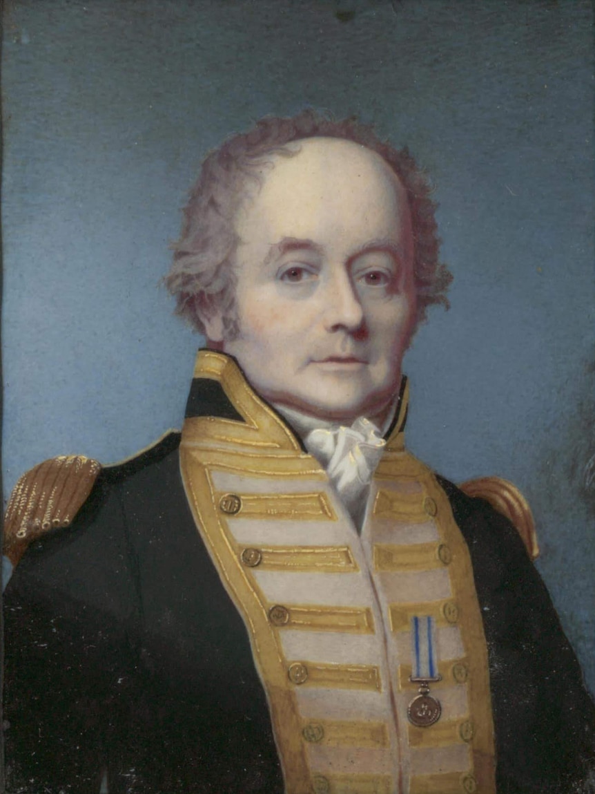 A portrait of William Bligh, dressed in a navy and gold jacket, by Alexander Huey.