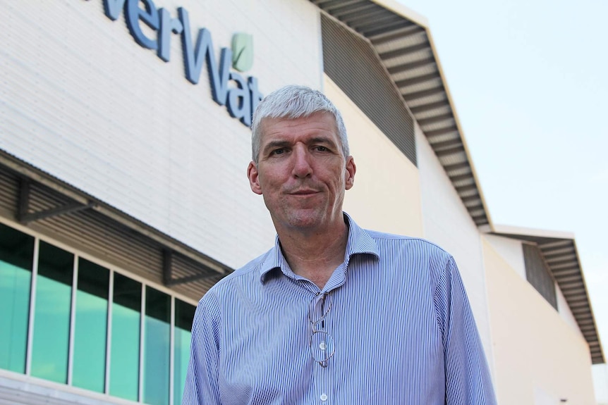 A photo of Power and Water's Nigel Deacon standing outside their building, looking at the camera.
