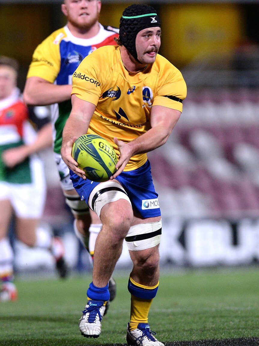 Leader of the pack ... Brisbane City captain Liam Gill looks to offload against the Rays