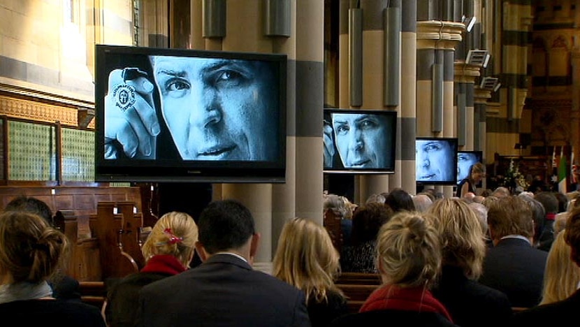 Jim Stynes' image appears on screens inside St Paul's Cathedral.