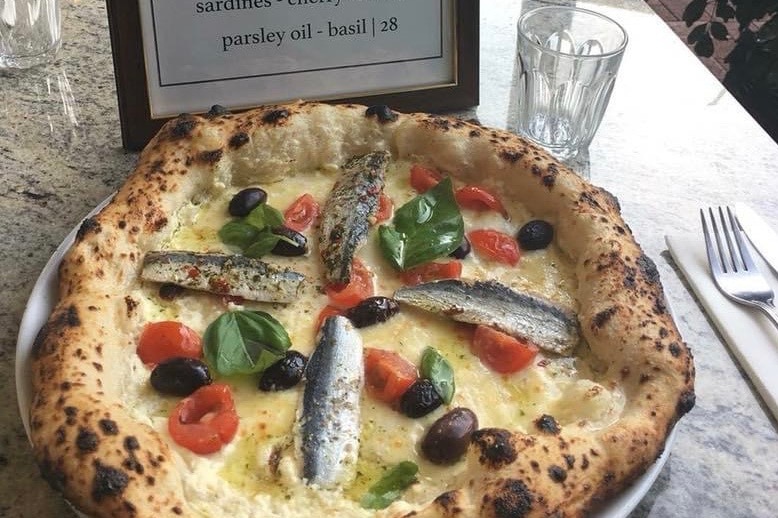Pizza withe NT sardines on it