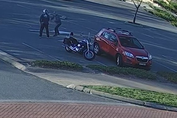 A still shot from CCTV of the elderly man being physically assaulted by the motorcyclist.