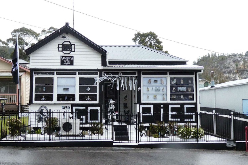 House painted black and white and decorated with streamers