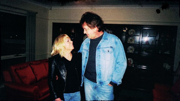 Christine and Terry Hodson standing in their living room