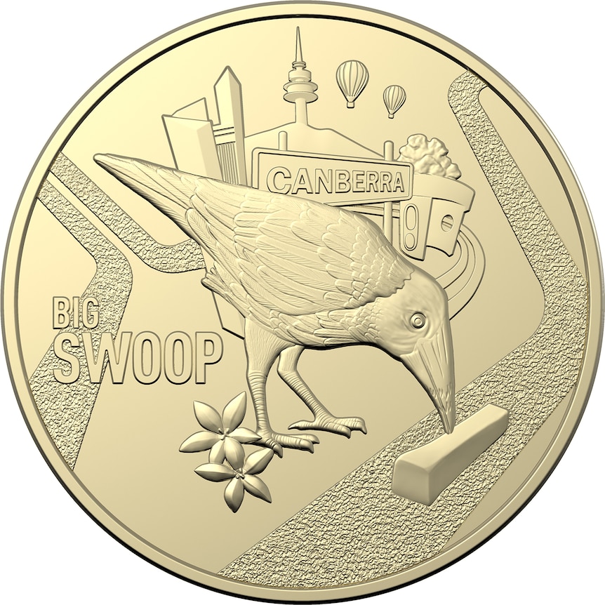 A gold coin featuring a magpie pecking a hot chip. 