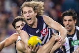 David Mundy of Fremantle is tackled