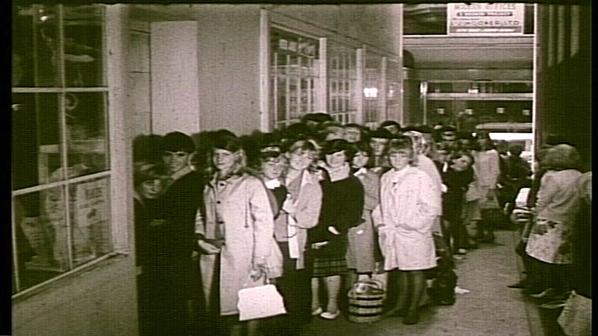 Fans line up for tickets to The Beatles concert at Melbourne's Festival Hall in 1964.