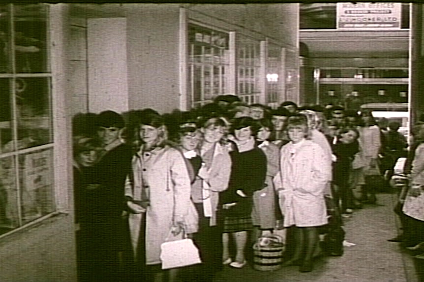 Fans line up for tickets to The Beatles concert at Melbourne's Festival Hall in 1964.