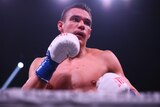 Tim Tszyu holds a pose in the ring