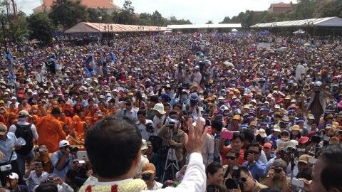 Cambodia's opposition leader Sam Rainsy addresses thousands of his supporters in the capital, Phnom Penh on Sunday September 15, 2013.