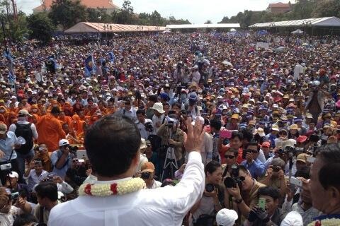 Cambodia's opposition leader Sam Rainsy addresses thousands of his supporters in the capital, Phnom Penh on Sunday September 15, 2013.