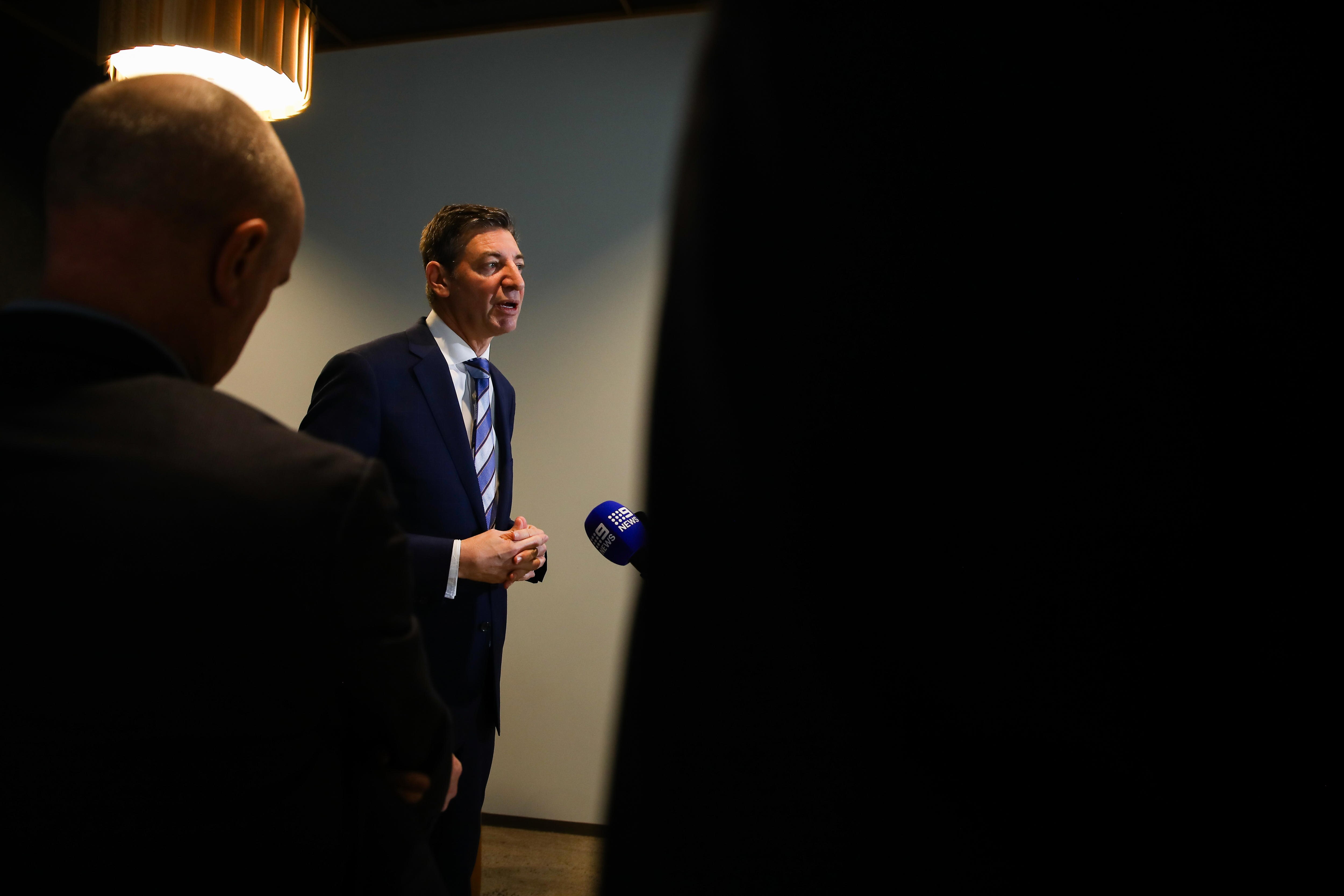 Basil Zempilas speaks at a press conference flanked by his advisors