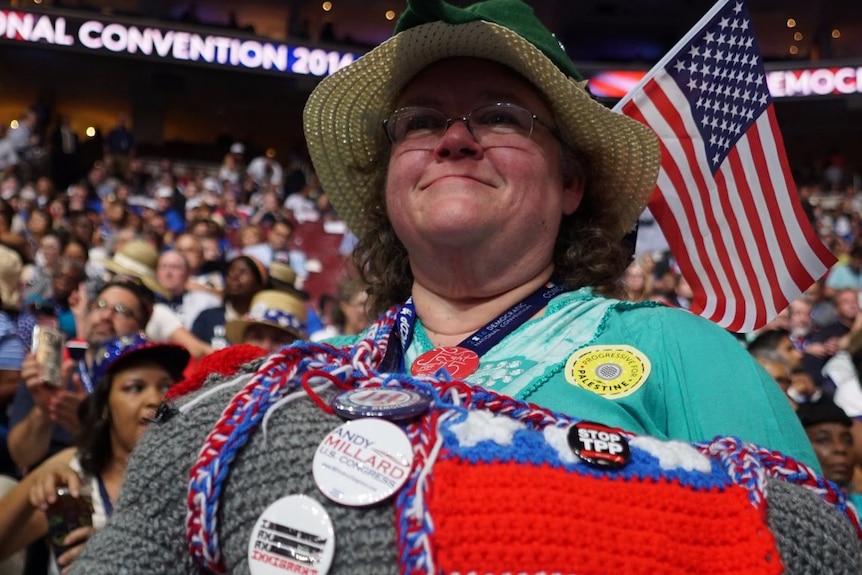 Robin Jordan carries a knitted plush Democratic-themed donkey at the Democratic Convention.