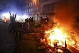Barricades burn as protesters clash with riot police during the protests at the G20 summit.