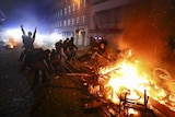 Barricades burn as protesters clash with riot police during the protests at the G20 summit.