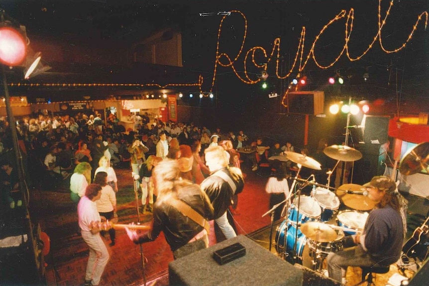 The Theatre Royal nightclub in the 1980s with people dancing and a band playing on stage.