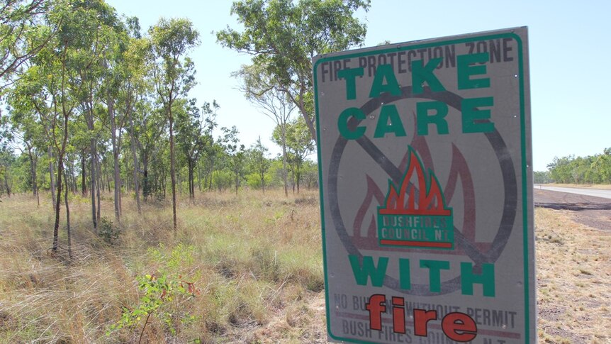 a bushfire awareness sign on the side of the road