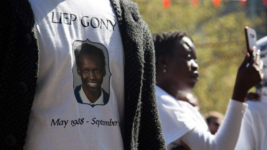 T-shirts bearing Liep Gony's face were worn by many at the memorial.