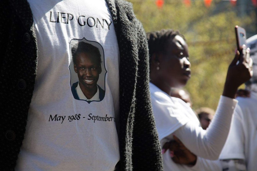 T-shirts bearing Liep Gony's face were worn by many at the memorial.