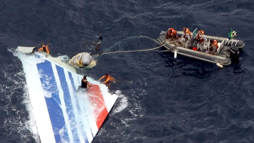 Brazilian Navy sailors retrieve the tail of Air France flight AF447