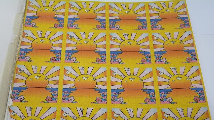 tabs with pictures of the sun on them which containing the drug LSD inside them