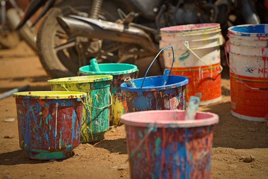Paint buckets in a Mumbai slum.