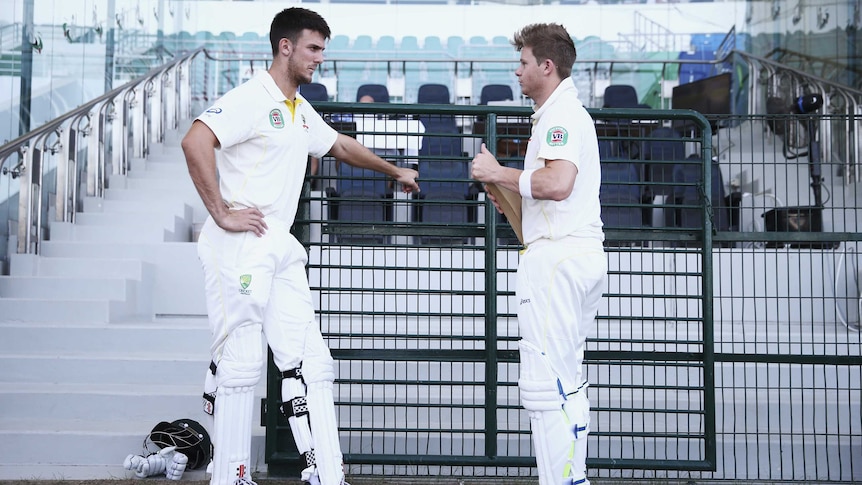 Marsh and Smith look on before day five