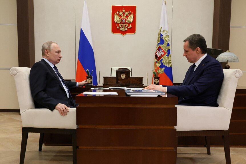 Russian President Vladimir Putin attends a meeting with Belgorod region governor Vyacheslav Gladkov.