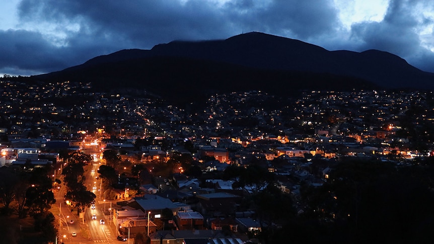 Hobart houses and streets under Mount Wellington at night