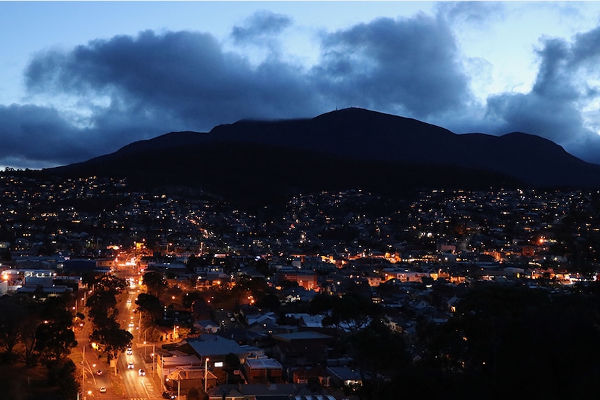 Hobart houses and streets under Mount Wellington at night