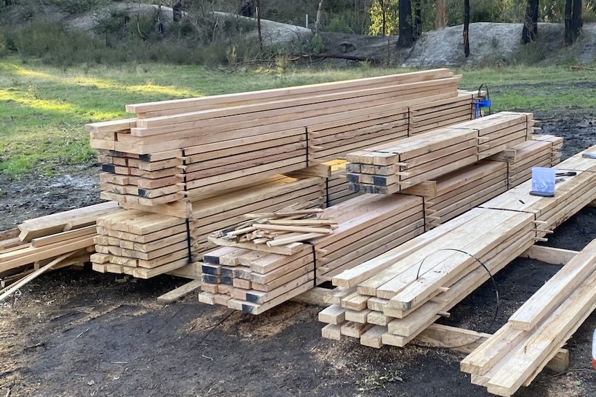 Piles of milled salvaged timber  